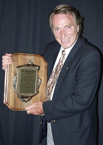 Frank holding award